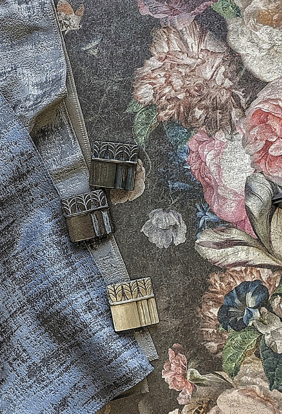 Drapery fabrics and curtain heading tape on a floral textile